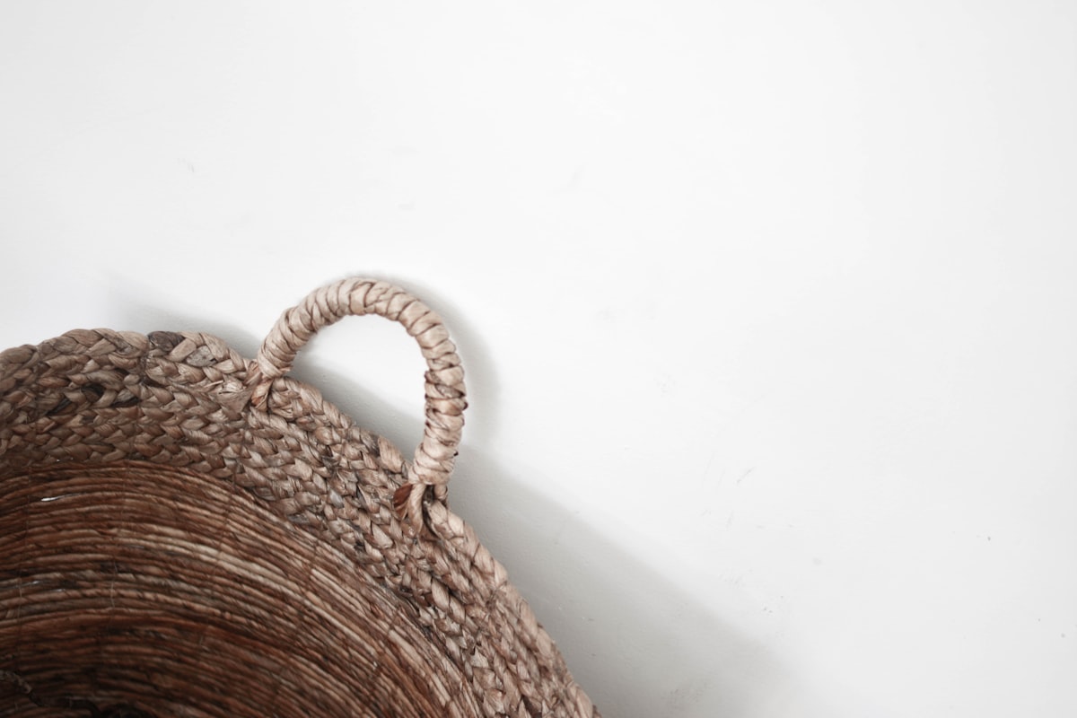 Rattan lidded bin